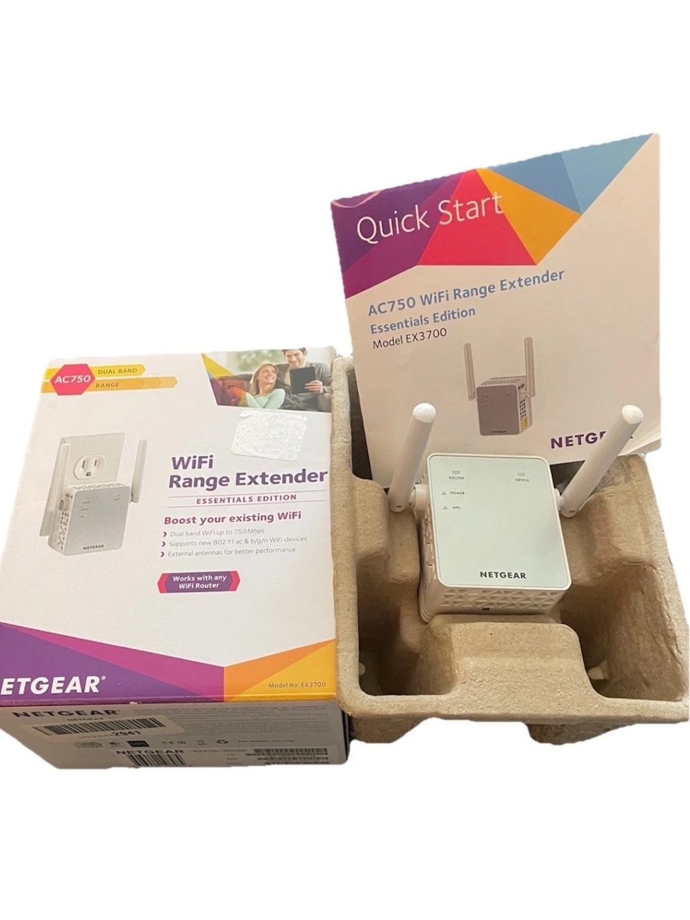 netgear WiFi Range Extender in white with purple & orange packaging